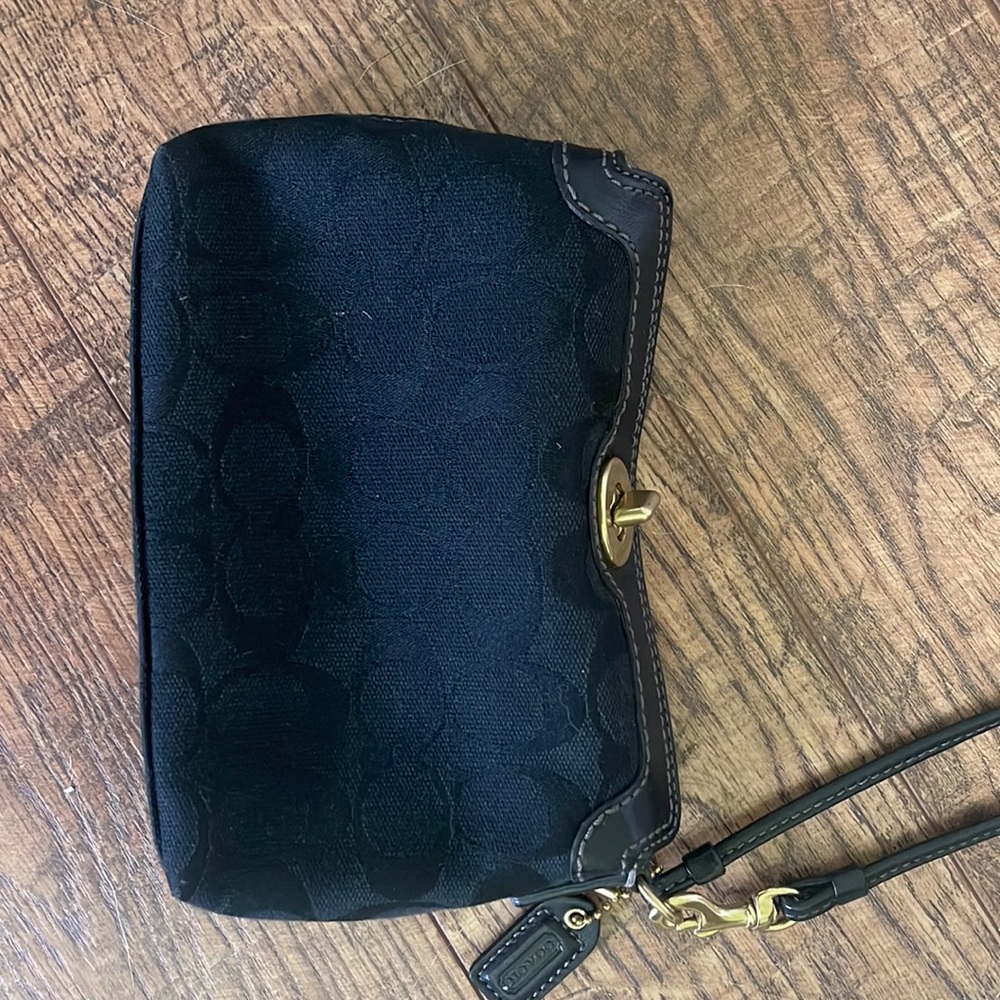 Authentic Coach brand Wristlet in signature print Black